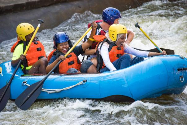 Family in a tube White Water Rafting